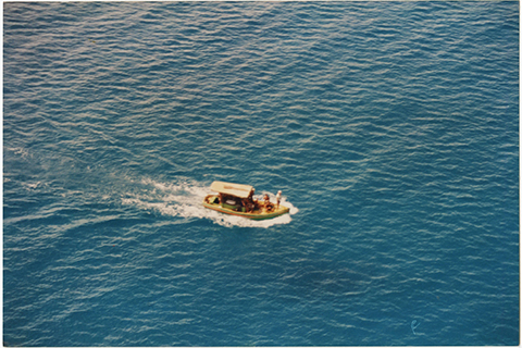 Aerial view of boat transporting rescued Cuban rafters, 1994. Cuban Photograph Collection. Cuban Heritage Collection, University of Miami Libraries.